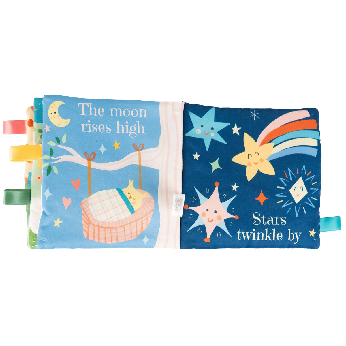 The Sweet Dreams Cloth Book by Cottage Door Press features a soft page with a peaceful baby sleeping in a basket and the phrase “The moon rises high.” On the following page, cheerful stars, a comet, and the words “Stars twinkle by” invite baby’s attention. Each page is edged with colorful tabs for little hands to explore. Designed as the perfect bedtime crinkle sensory book, it encourages babies to engage and discover on every soft, interactive page.