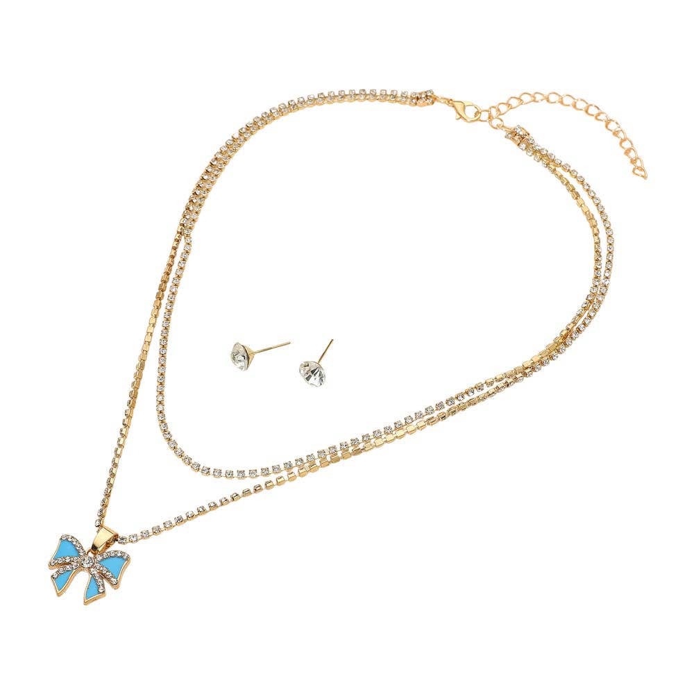 The Sensibling Corp. Bow Pendant Layered Chain Necklaces feature a gold chain with a blue and gold bow pendant, paired with two round clear stud earrings, displayed on a white background.