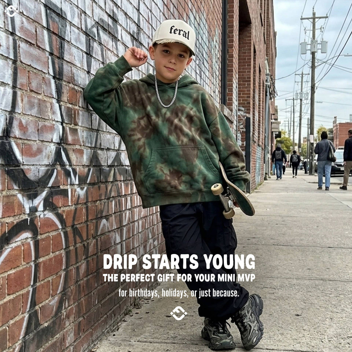 A young boy wearing a tan Feral 2-Tone Hat and a dark green tie-dye hoodie stands on a sidewalk holding a skateboard, with text overlay reading DRIP STARTS YOUNG and promotional copy.