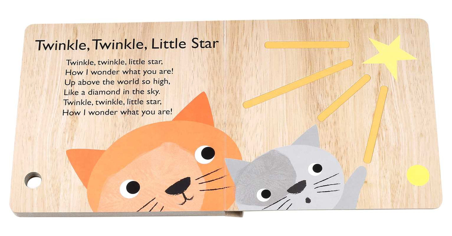 A page from the Hey Diddle Diddle Book by Simon & Schuster shows an orange and a gray cat gazing at a yellow star with yellow lines, set against a wood-textured background, featuring “Twinkle, Twinkle, Little Star” lyrics.