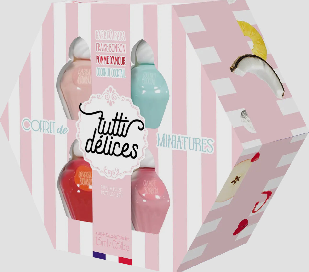 A hexagonal gift box with pink and white stripes labeled "Miniature Bottles Set" by Tutti Delices, containing four miniature perfume bottles in pastel pink, blue, red, and peach.