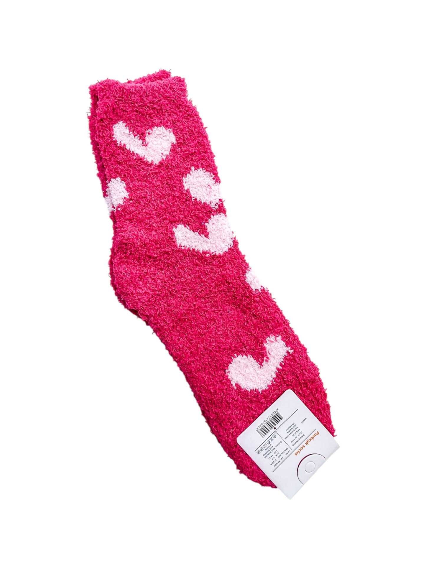 Sweetheart Lounge Socks by love & repeat: a pair of fuzzy pink socks with white heart patterns, shown with a barcode and product tag.