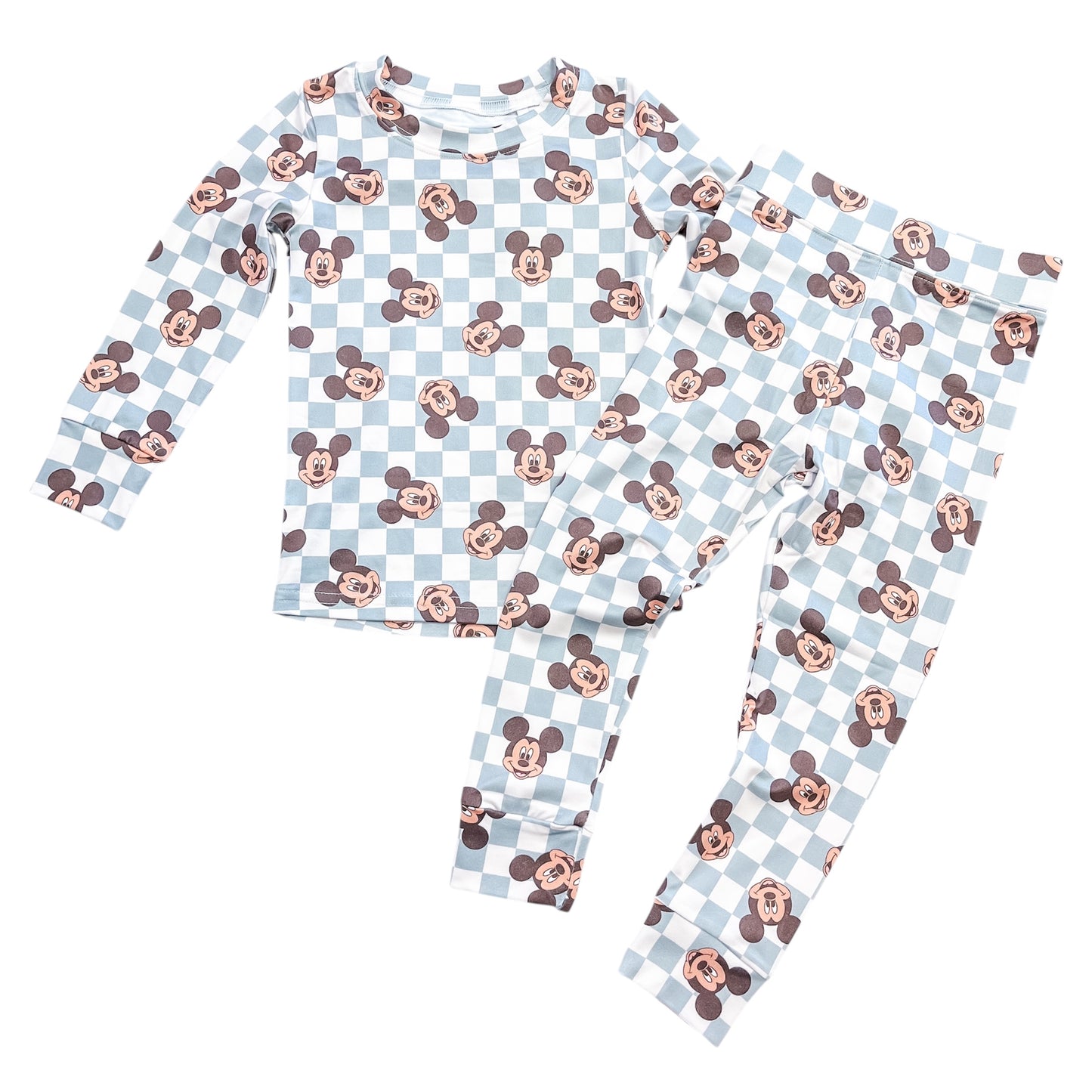 The Classic Mouse Checkered Jammies Set by Tiny Tot Bundles features a light blue and white checkered long-sleeve top and pants, adorned with repeating Mickey Mouse faces.