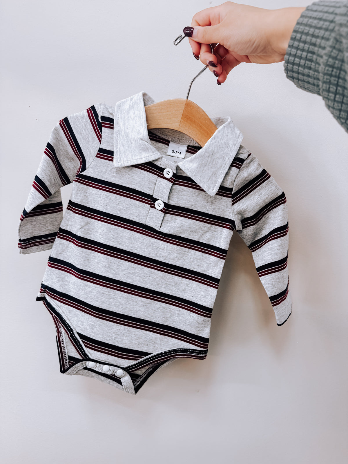 Maroon Striped Polo Romper with long sleeves, a polo collar, and maroon, black, and gray horizontal stripes.
