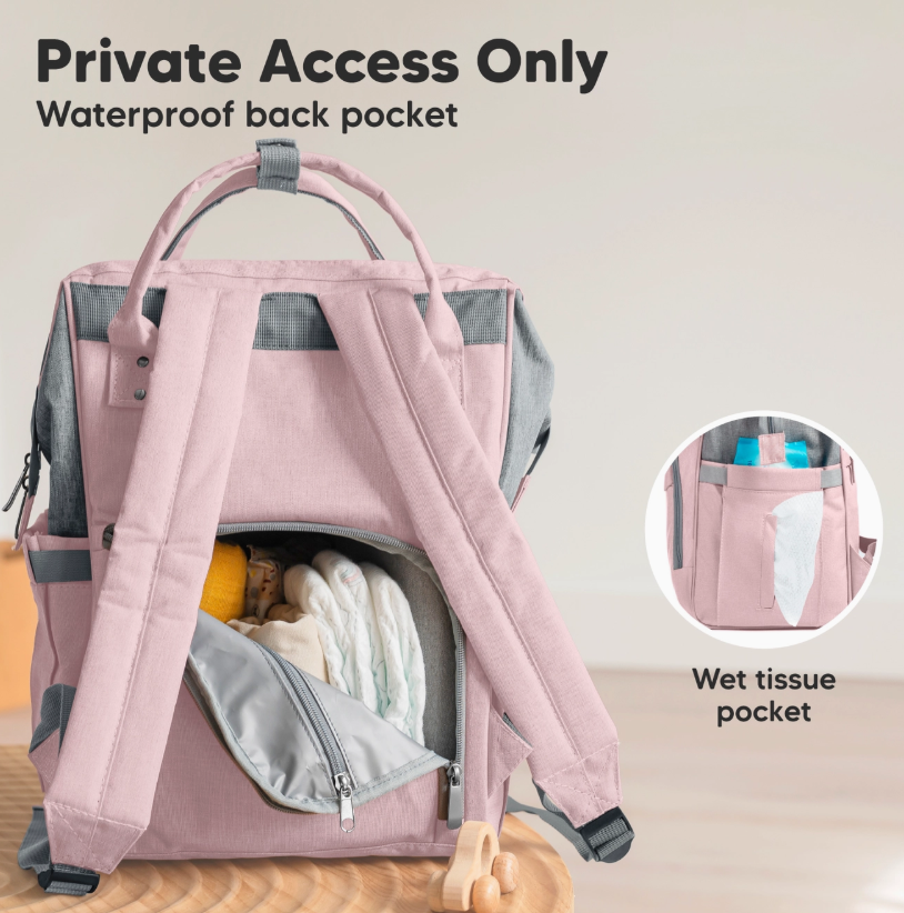 The keababies Diaper Bag Backpack in Pink Gray sits on a table with its waterproof back pocket unzipped, revealing diapers and baby essentials. An inset highlights the side pocket with wet tissues. Text reads: “Private Access Only, Waterproof back pocket.”.