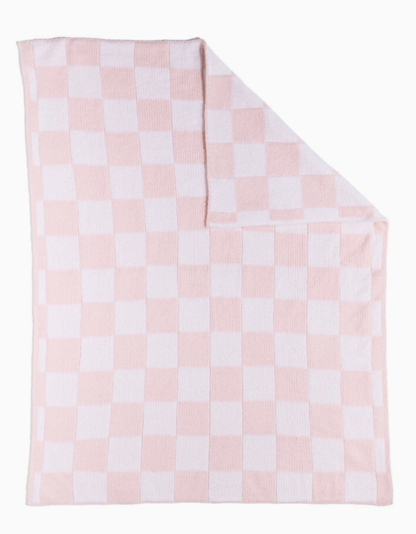 The living textiles Chenille Blanket - Pink Check features a soft pink and white checkerboard pattern, neatly displayed with one corner folded to show both sides.