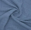 Close-up of the crover 100% Cotton Waffle Baby Blanket in blue, highlighting its soft, textured woven surface and gentle swirl pattern with subtle folds.