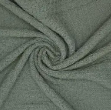 Close-up of crover's 100% Cotton Waffle Baby Blanket in green, featuring soft, textured fabric gathered and twisted into a spiral at the center.