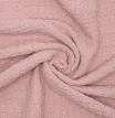 A close-up of crover's 100% Cotton Waffle Baby Blanket in Muave shows its soft, cozy textured fabric arranged in a swirling spiral pattern.