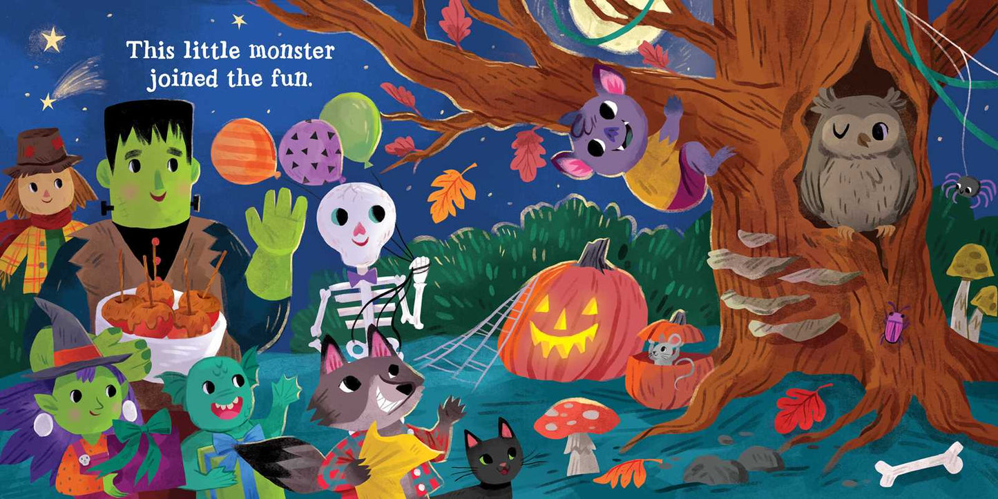A festive and colorful Halloween scene from Simon & Schuster’s “This Little Monster” by Dori Elys features a group of friendly monsters and animals in costumes gathered around a tree with an owl, pumpkins, and stars in the background.