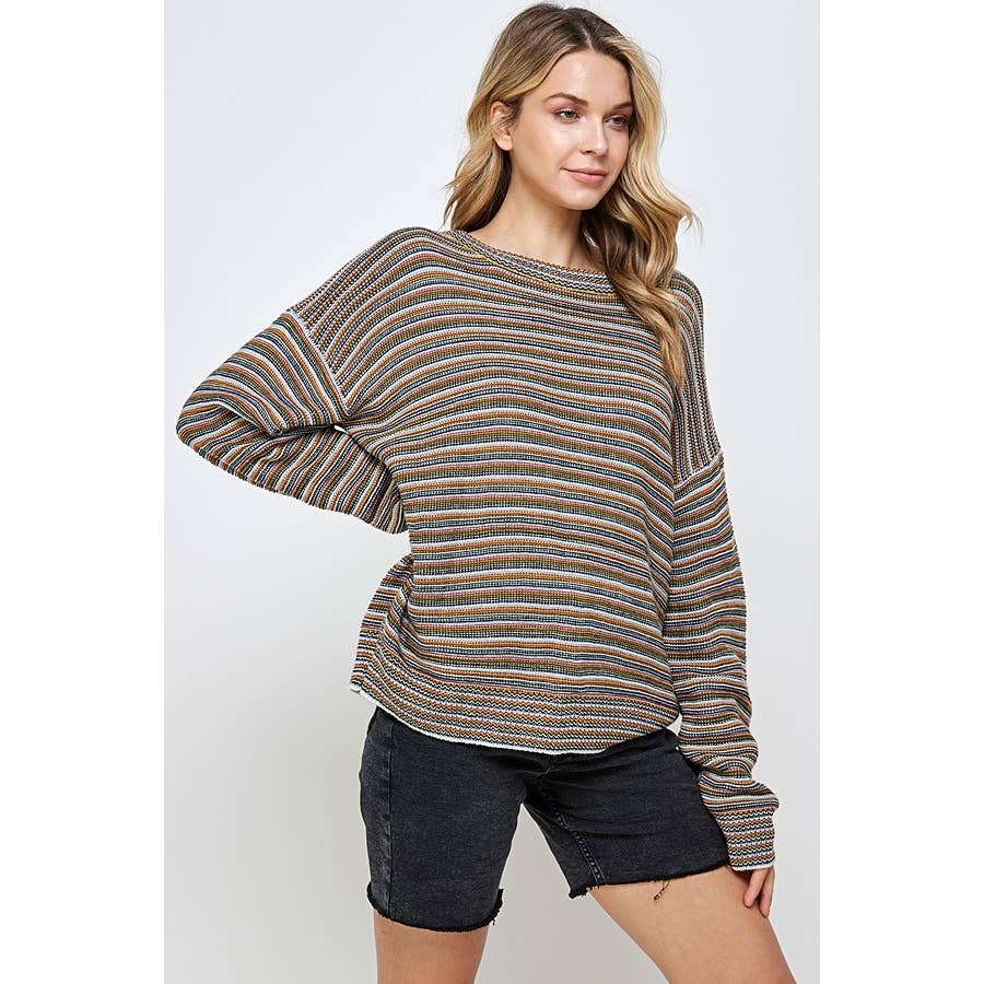 A person wearing a Sweet Generis Multi Color Stripe Pullover Sweater, featuring long sleeves, ribbed texture, and thin, multi-colored horizontal stripes, paired with black denim shorts.