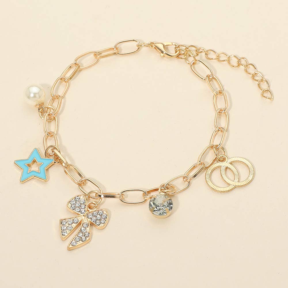 The Sensibling Corp. Star Charm Bracelets feature gold chains with a blue star, pearl, rhinestone-studded bow, clear gem, and interlocking gold rings, shown on a light beige background.