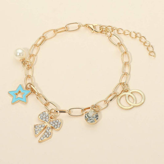 The Sensibling Corp. Star Charm Bracelets feature gold chains with a blue star, pearl, rhinestone-studded bow, clear gem, and interlocking gold rings, shown on a light beige background.