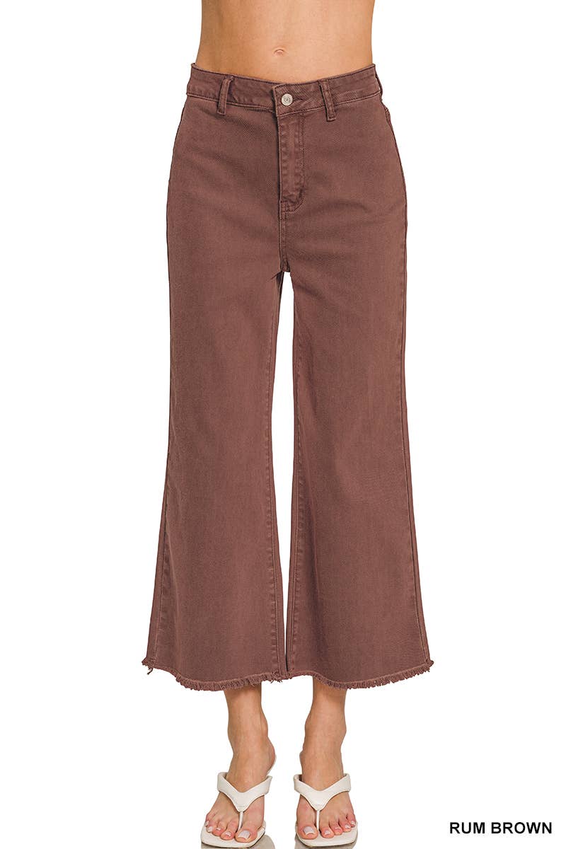 A person wearing 42POPS Mocha Straight Leg Wide Pants with a high-waisted, wide-leg cropped fit, featuring raw hems, paired with white sandals. Only the lower torso and legs are visible.