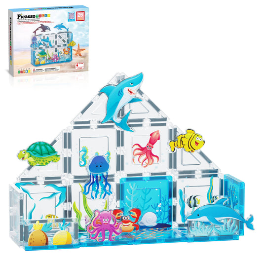 The PicassoTiles 26 Piece Marine World Magnetic Building Set by PicassoTiles creates a clear triangular aquarium with colorful sea creatures like a shark, turtle, octopus, jellyfish, crab, and dolphin. The product box appears in the top left corner.