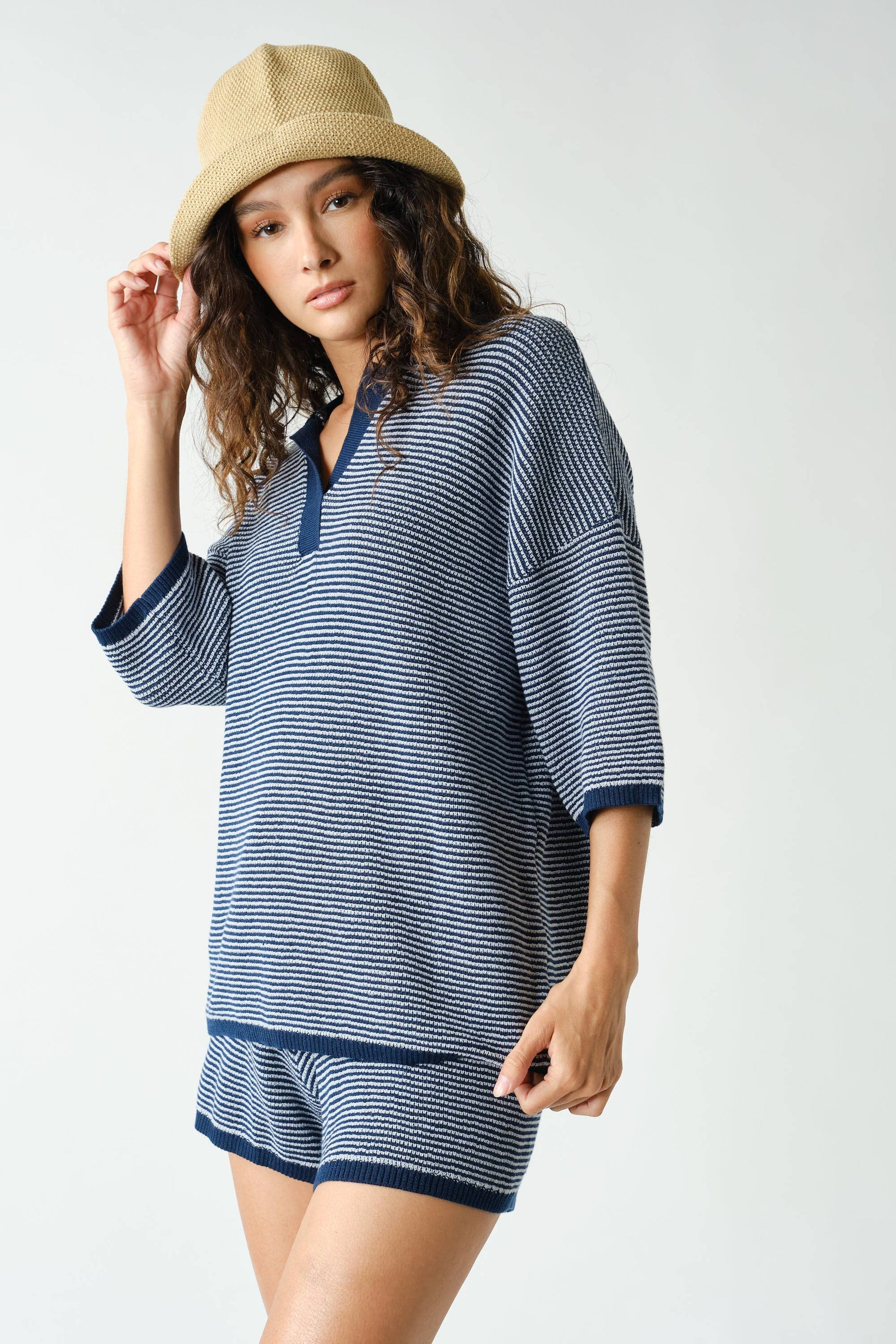 A person wearing the Mono B Navy Coastal Breeze Knit Set stands against a plain background, looking at the camera.