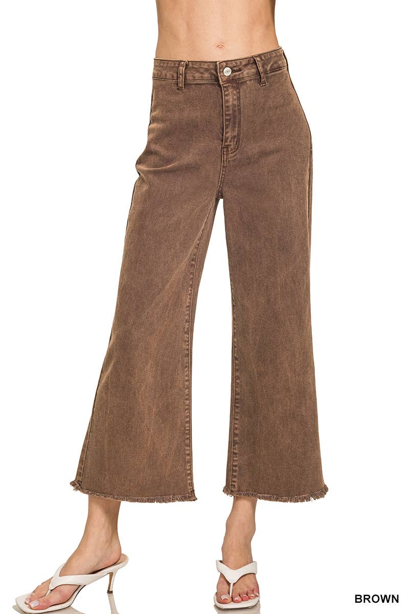 A person wearing the 42POPS Mocha Straight Leg Wide Pants, featuring a high waist and cropped wide-leg silhouette with raw hems, stands in white heeled sandals against a white background.