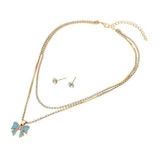 The Sensibling Corp. Bow Pendant Layered Chain Necklaces feature a gold chain with a blue and gold bow pendant, paired with two round clear stud earrings, displayed on a white background.
