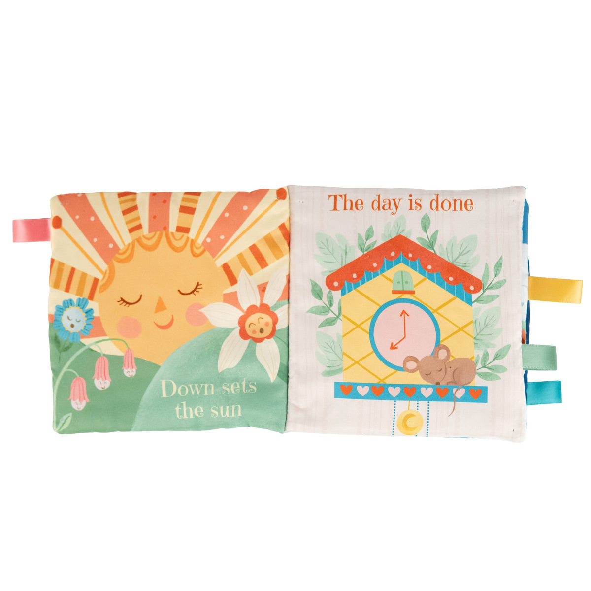 The Sweet Dreams Cloth Book by Cottage Door Press features fabric pages with a sun setting and flower on the left, accompanied by the text “Down sets the sun.” On the right, you’ll find a cuckoo clock and mouse next to the words “The day is done.” Colorful ribbon tags trim each edge, creating an engaging bedtime cloth book and delightful crinkle sensory experience for babies.