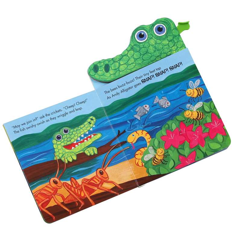 The "Andy Alligator Book" by Simon & Schuster features a colorful page with a green alligator, two orange crickets, three fish, and three bees by water and pink flowers, plus a textured green alligator head at the top corner.