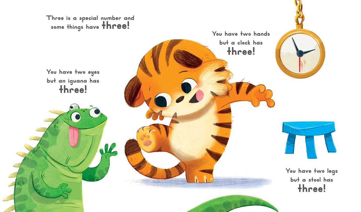 A cartoon tiger points at a green iguana and blue three-legged stool while a two-handed clock shows the number three—illustrating trios in Simon & Schuster’s "Now You Are 3 Book.
