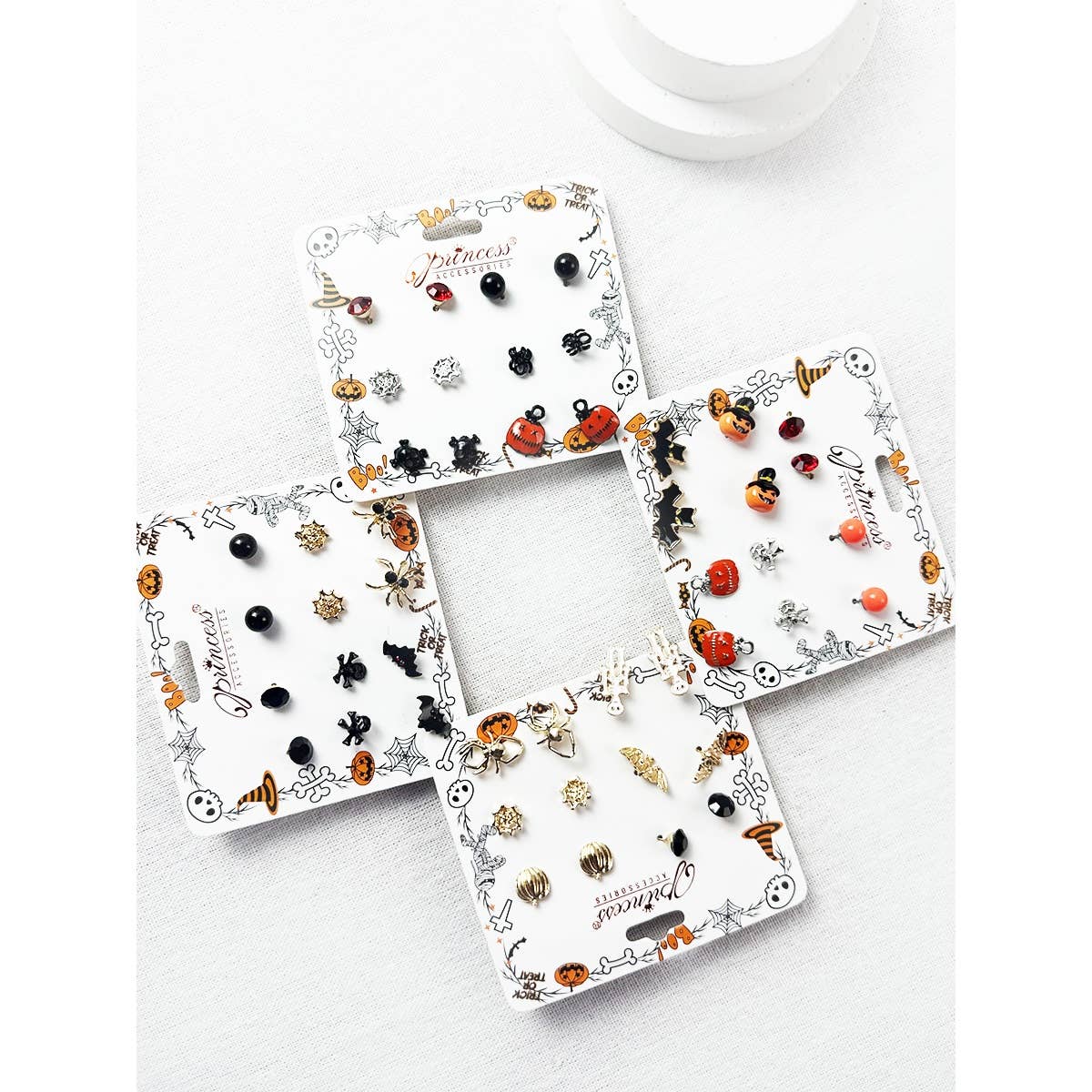 Love and Repeat Cute Halloween Theme Earring Set featuring four cards of stud earrings, including pumpkins, ghosts, spiders, skulls, and witch hats.