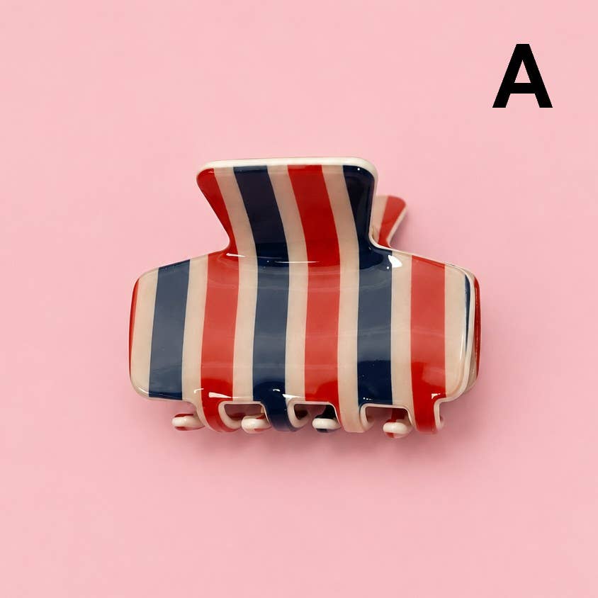 Striped & Plaid Hair Claw Clip with vertical red, white, and blue stripes.
