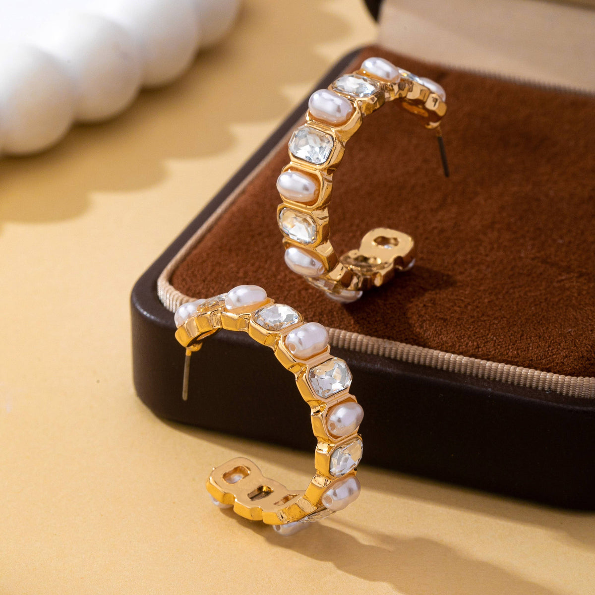 JOSSLYN by wall to wall Pearl & Rhinestone Hoop Earrings in gold featuring alternating inset pearls and clear rectangular crystals.