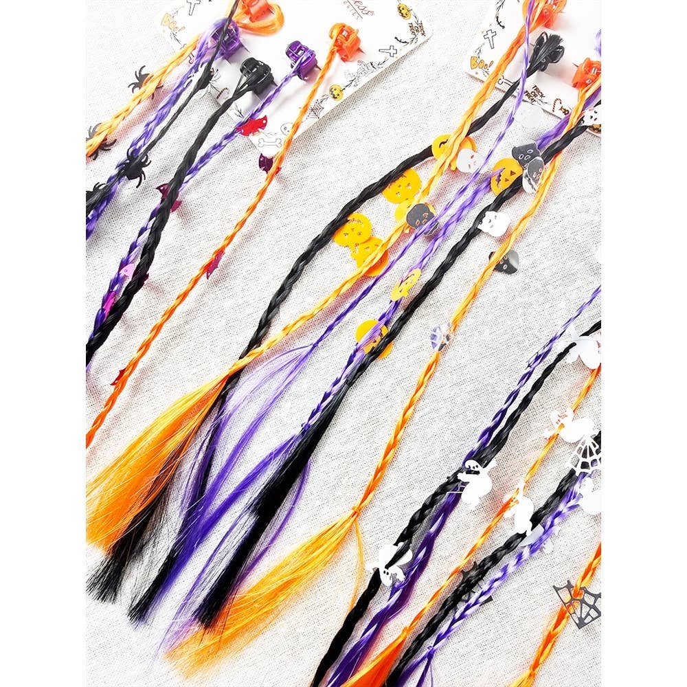 Love and Repeat Halloween Braid Hair Extension Clips in black, orange, and purple, featuring small charms shaped like spiders, pumpkins, ghosts, and skulls.