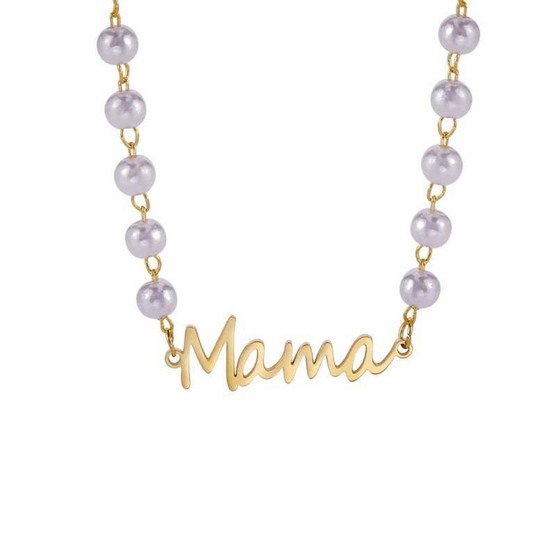 The Pearl Mama Necklace by JOSSLYN by wall to wall features the word “Mama” in elegant script, accented on each side by round white pearls.