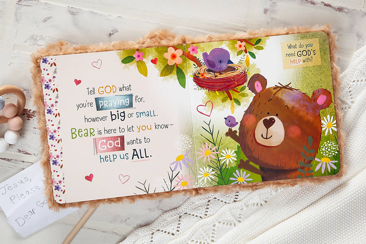 A page from the Prayer Bear Book by BroadStreet Publishing Group, LLC features an open children’s book with a gentle, friendly scene: an illustration of a bear and a bird in a nest surrounded by flowers. The text, displayed in colorful and playful fonts, shares a message about praying to God for help, creating a warm and inviting atmosphere.