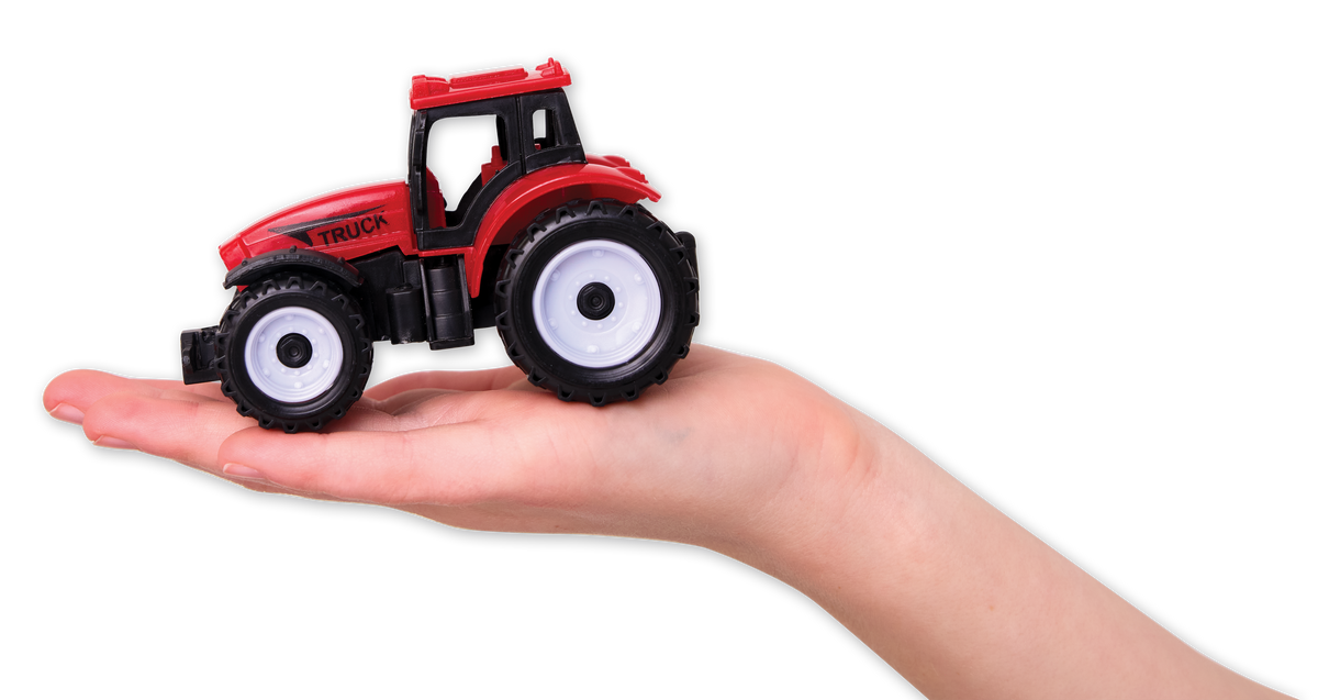 A person’s hand holds a small red tractor from the Faber-Castell / Creativity for Kids Sensory Bin Farm Activity Kit for Kids, featuring black wheels and set against a plain white background—perfect for encouraging fine-motor skills during play.