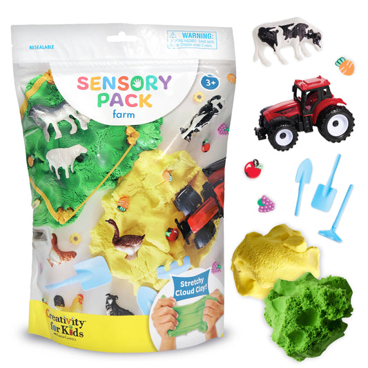 The Faber-Castell / Creativity for Kids Sensory Pack Farm On the Go Sensory Play Set for Kids features farm-themed stretchy cloud clay in yellow and green, animal figurines, a red toy tractor, and miniature farm tools. The package displays various animals alongside the colorful clay.