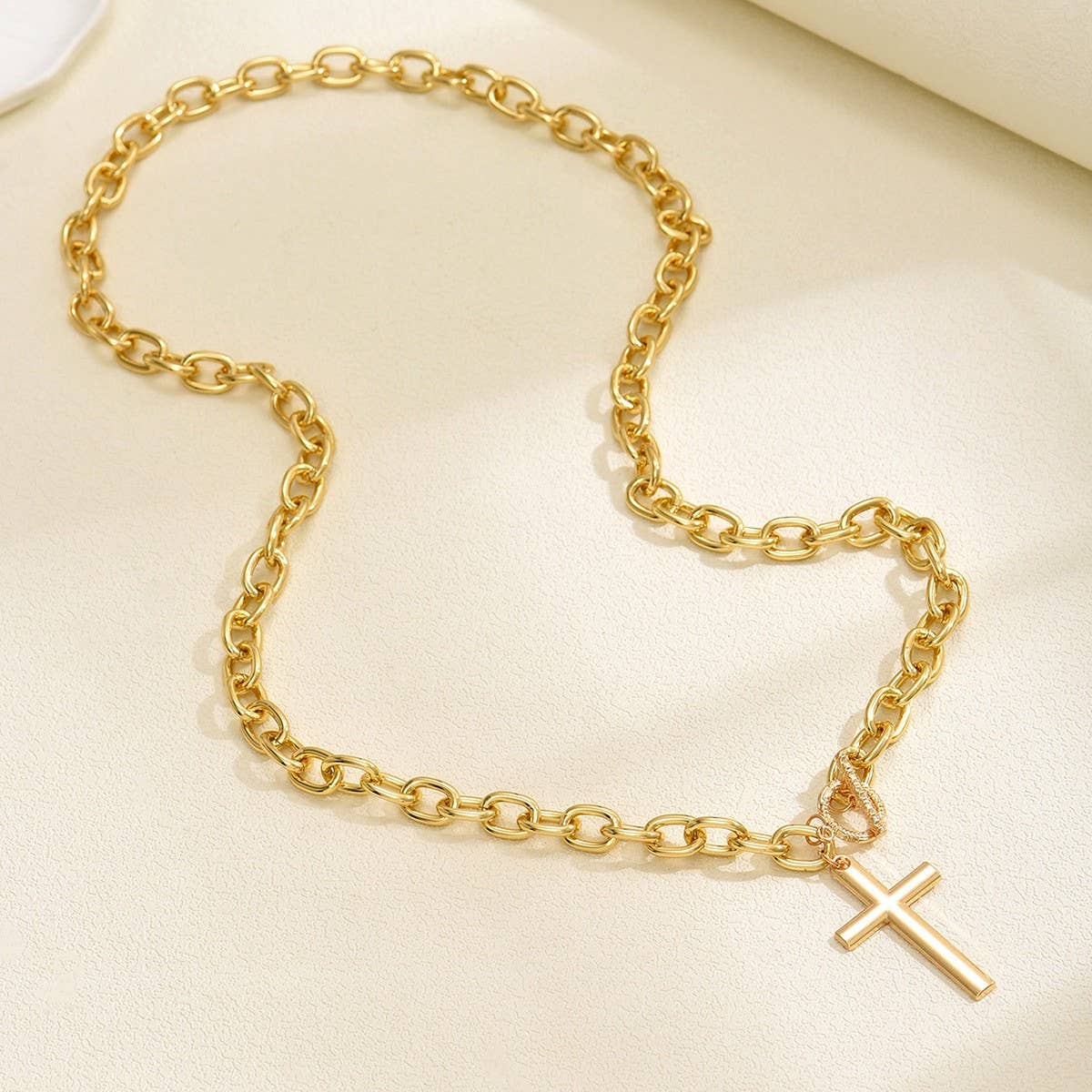 JOSSLYN by wall to wall Cross Chunky Chain Necklace featuring a gold chunky link chain with a cross pendant.