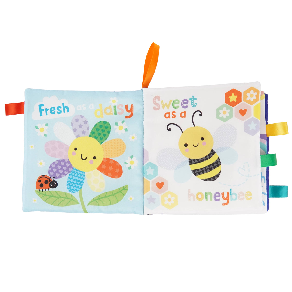 The Hello, Sunshine! Cloth Book by Cottage Door Press is open to pages featuring cheerful illustrations: a smiling flower with a ladybug and the phrase “Fresh as a daisy,” and a happy bee with flowers labeled “Sweet as a honeybee.” Bright orange and green ribbon tabs add sensory appeal to this engaging baby book, thoughtfully designed for little hands and curious minds.