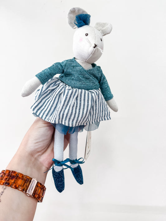 A hand holds the Little Dancer Mice Stuffed Animal by Tiny Tot Bundles, a white mouse plush wearing a teal top, striped skirt, matching shoes, and headband, shown against a plain white background.