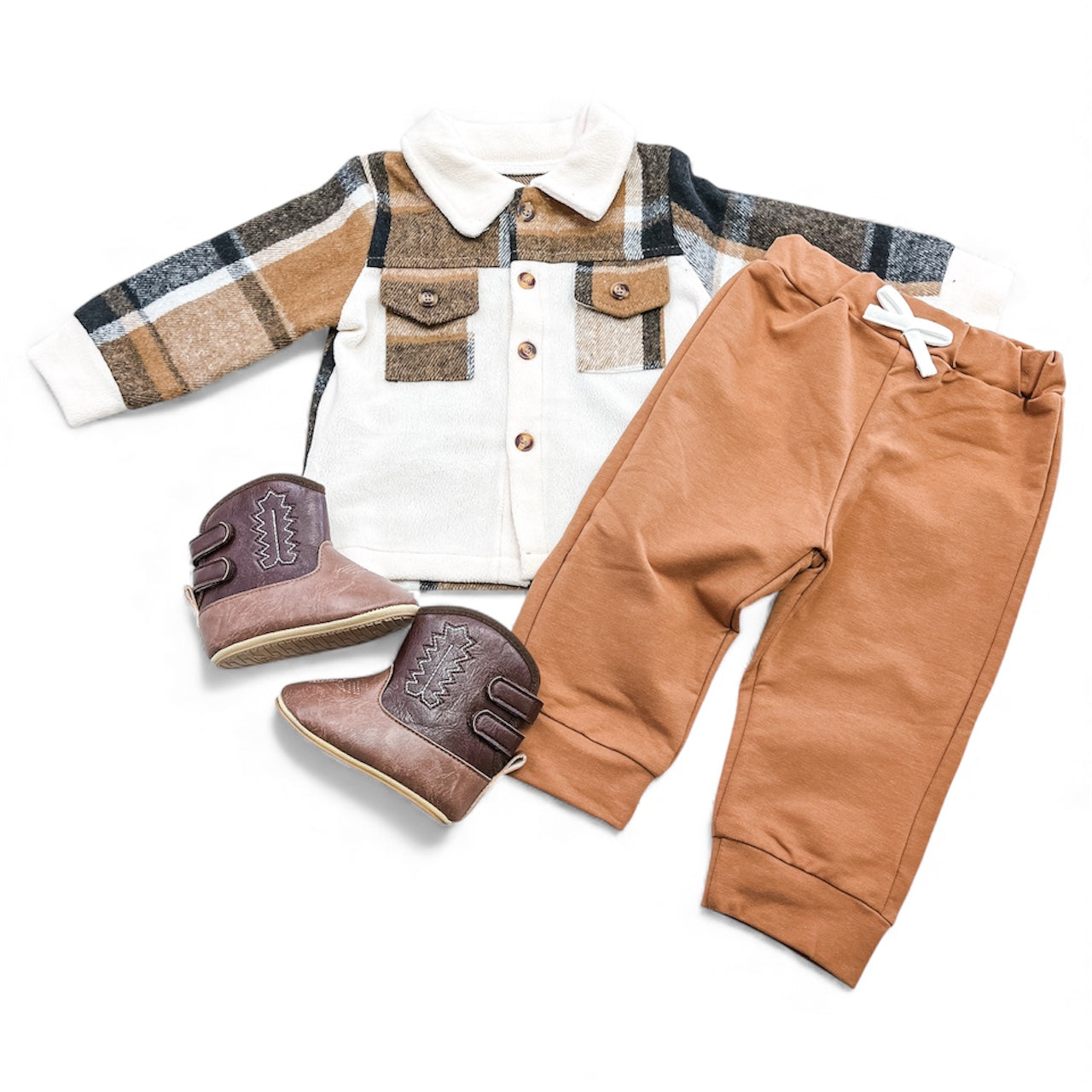 The Little Woodsman Set by Tiny Tot Bundles features a plaid button-up shirt, brown pants with a white drawstring, and brown ankle boots, styled together on a white background.