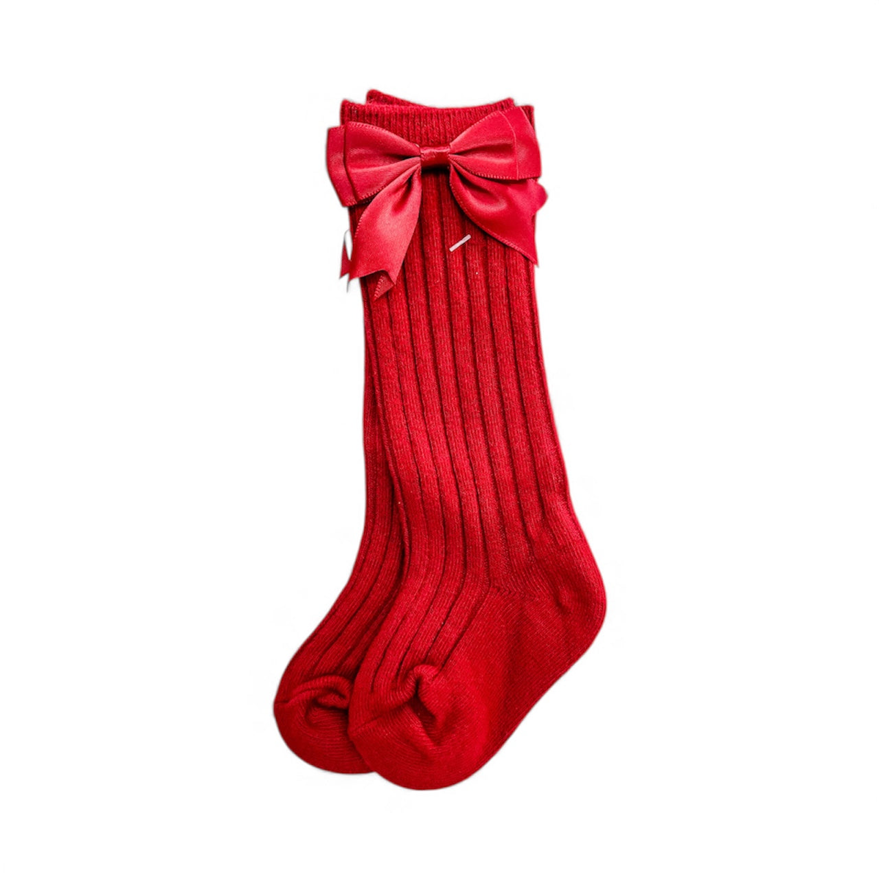 Pretty Bow Ribbed Socks by Tiny Tot Bundles: a pair of long, red ribbed socks with large matching red satin bows at the top, shown on a white background.