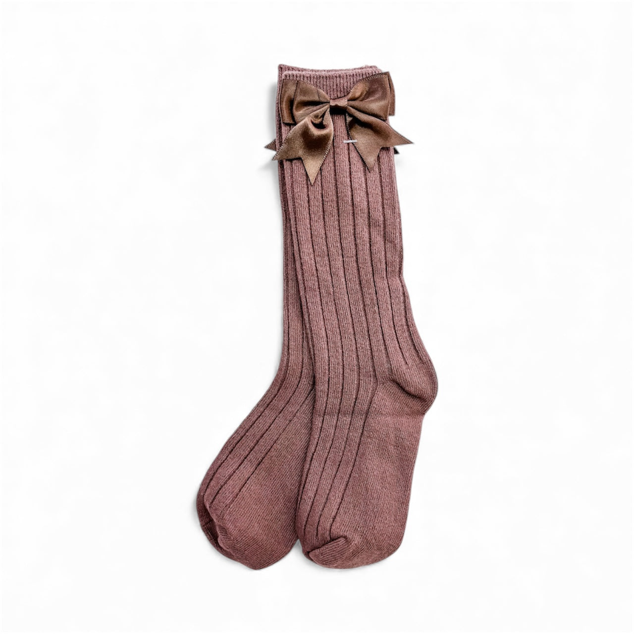 Pretty Bow Ribbed Socks by Tiny Tot Bundles: a pair of mauve, ribbed knee-high socks featuring a large matching bow on one sock, shown against a plain white background.