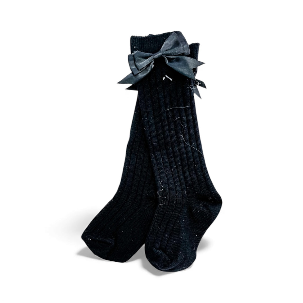 Pretty Bow Ribbed Socks by Tiny Tot Bundles: black knee-high ribbed socks with a black satin bow at the top, displayed on a white background.