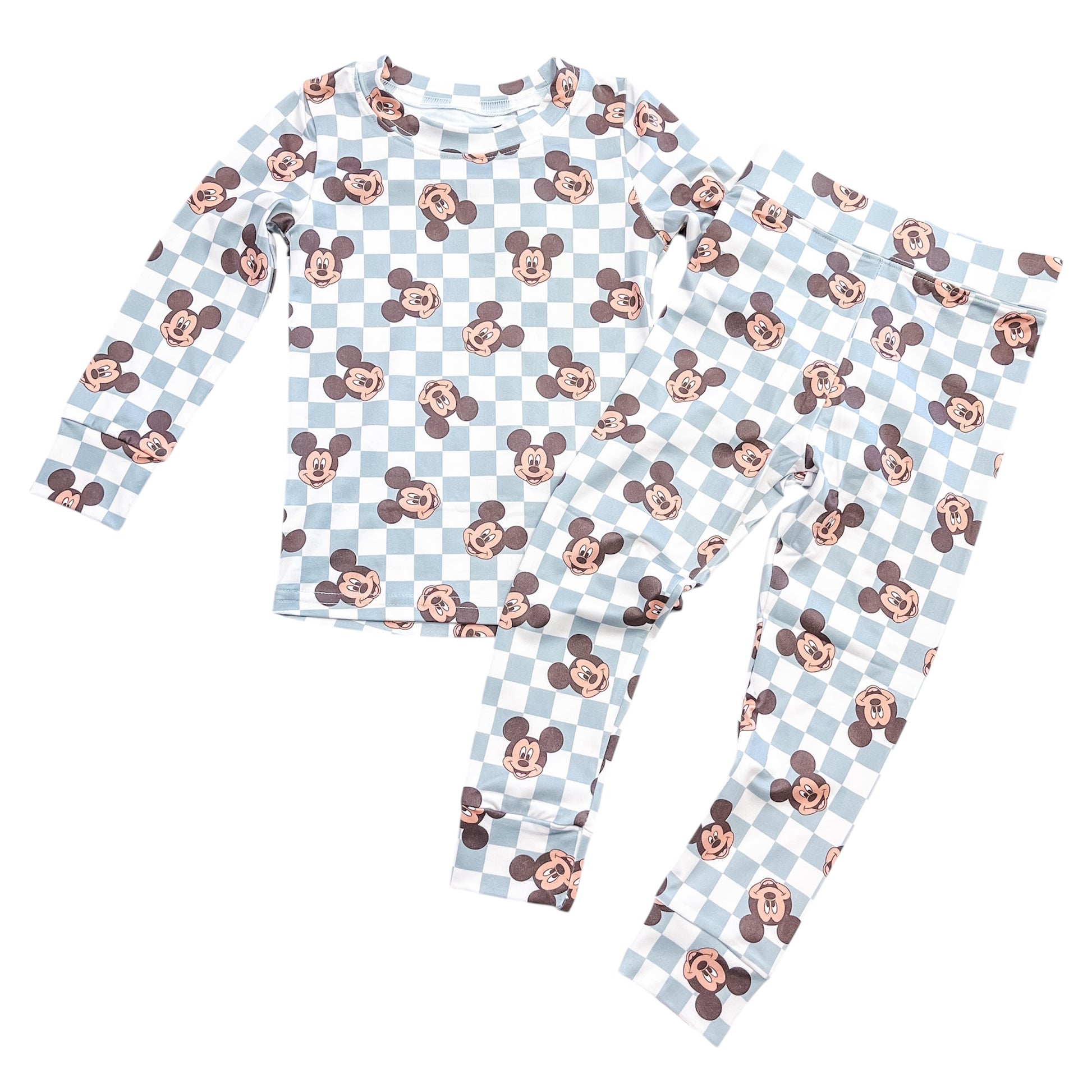 The Classic Mouse Checkered Jammies Set by Tiny Tot Bundles features a light blue and white checkered long-sleeve top and pants, adorned with repeating Mickey Mouse faces.
