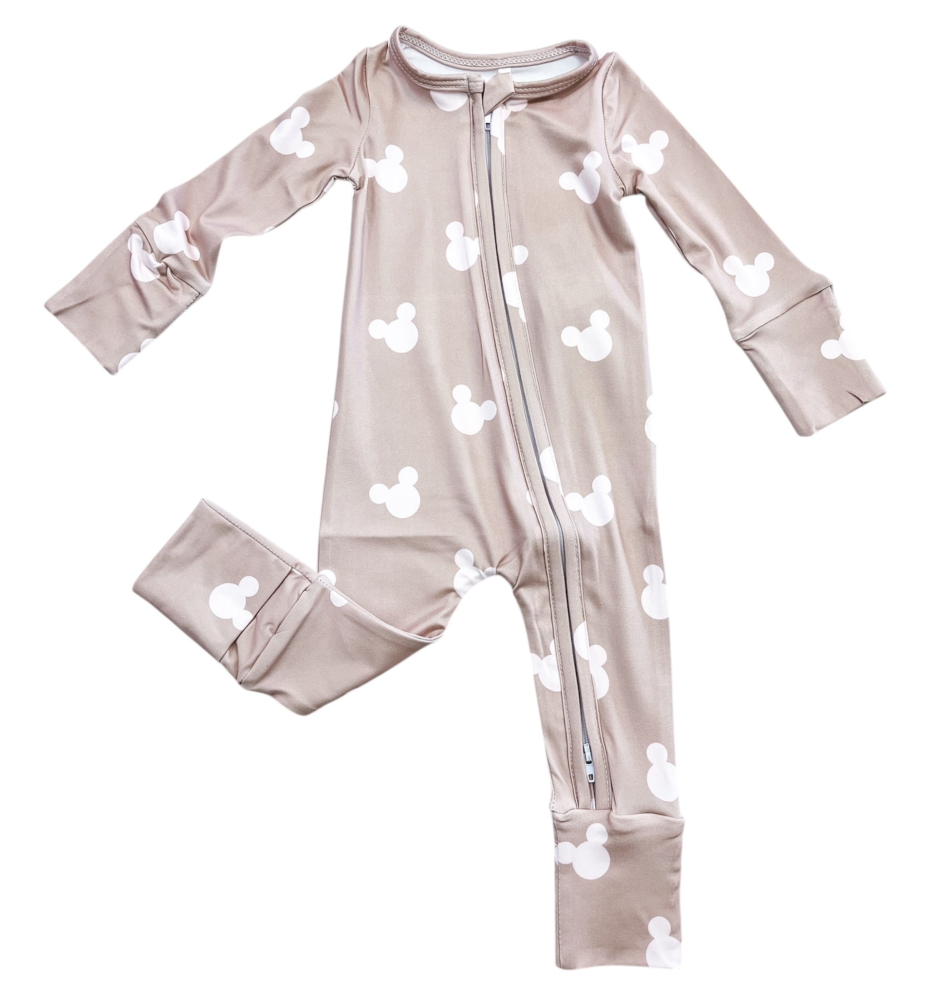 The Tiny Tot Bundles Cozy Mouse Zippy is a light brown, long-sleeve baby romper featuring white Mickey Mouse head silhouettes and a diagonal front zipper.