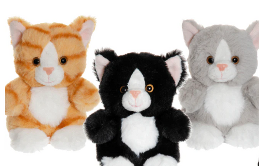 The Triaction Teddy Cats Companion features three plush toy cats—orange striped, black, and gray—with white paws, bellies, snouts, round eyes, and pink noses. They sit side by side against a white background.