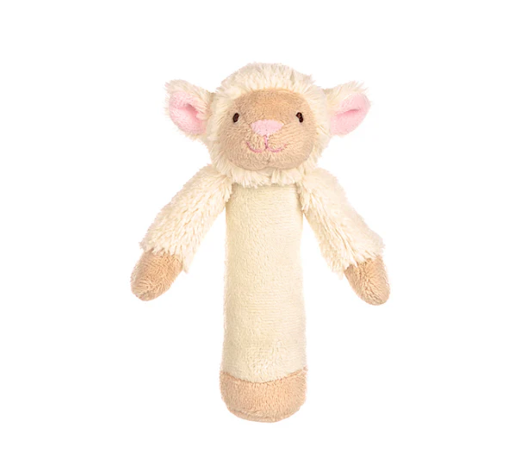 The Triaction Lamb Rattle features a plush beige body, light brown feet, pink-lined ears, a smiling face with stitched details, and is displayed against a white background.