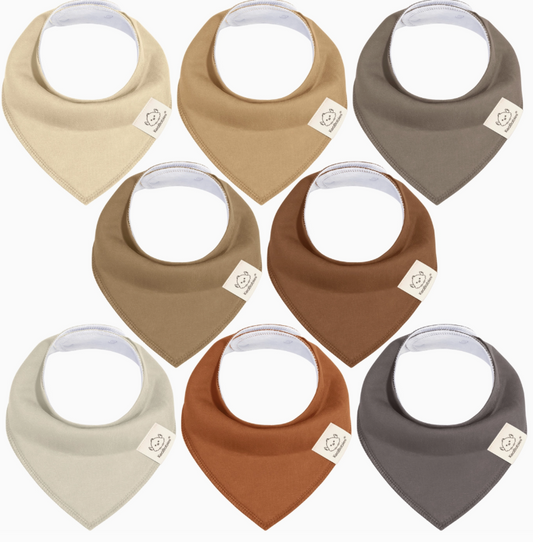 The keaBabies 8-pack Baby Bandana Bibs - Terracotta features bibs in neutral colors like tan, brown, cream, taupe, gray, and rust. Each bib has a beige logo tag on the left side. Bibs are arranged in two rows of four.
