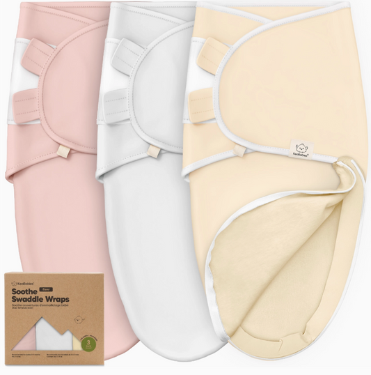 Three keababies 3 Piece Soothe Zippy Baby Swaddles in pink, white, and daffodil are displayed side by side. The daffodil swaddle is partially open, with a Soothe Swaddle Wraps box visible in the lower left corner.