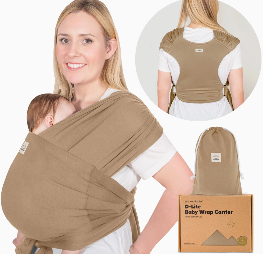 A smiling woman carries a sleeping baby in the keababies Baby Wrap Carrier - Warm Hearth. An inset shows the back view. A drawstring bag and product box labeled "Baby Wrap Carrier - Warm Hearth" are also displayed.
