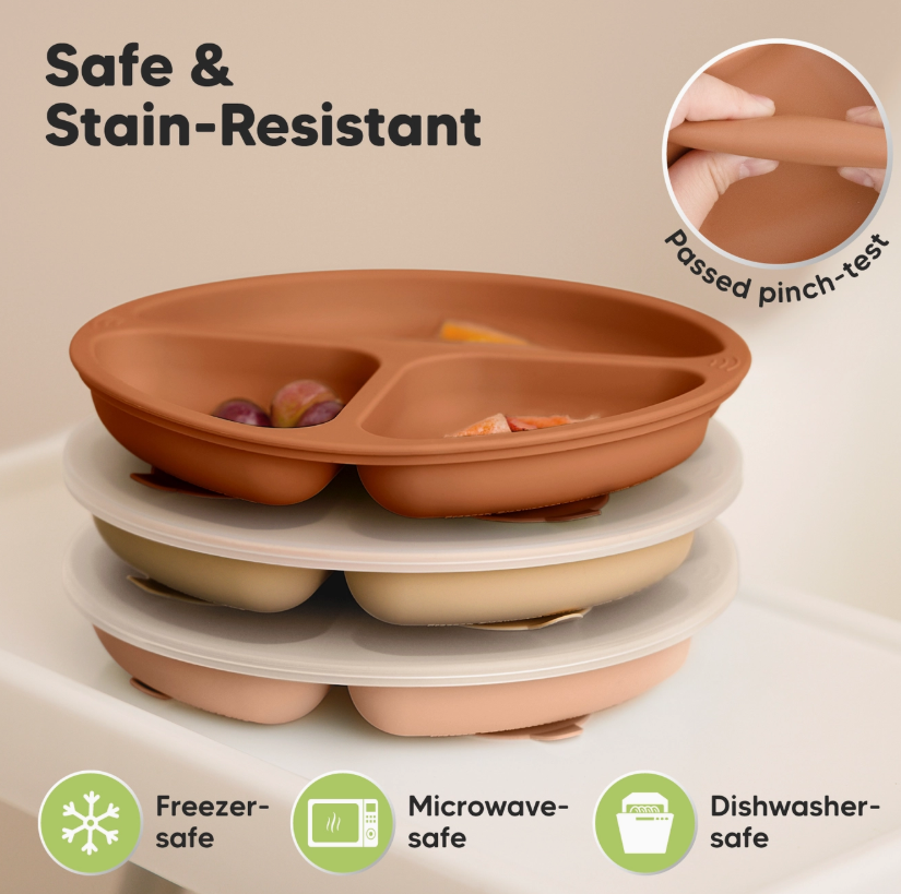 The keababies 3-Pack Prep Suction Plates - Terracotta are shown stacked in tan and cream, each divided and filled with fruit. Icons indicate they're freezer, microwave, and dishwasher safe. An inset shows a hand pinching one plate.