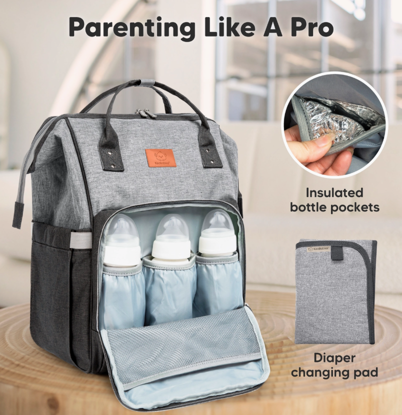 The keababies Diaper Bag Backpack - Graphite features three insulated bottle pockets, a separate changing pad, and an inset image of a hand placing an item in an insulated pocket. Text reads: “Parenting Like A Pro.”.