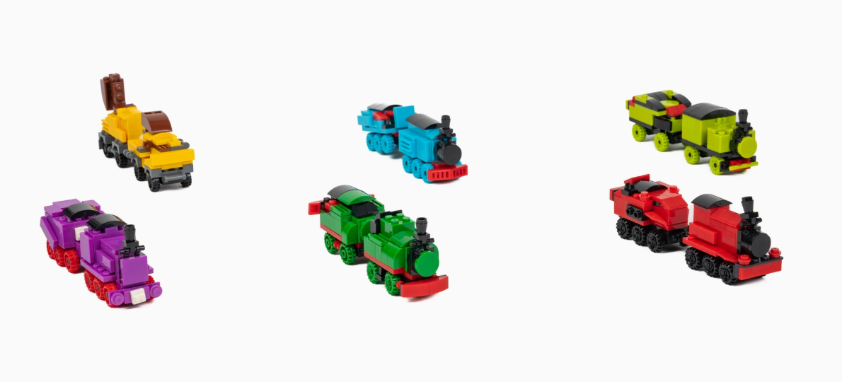 Six colorful toy train engines from the Toy Smith Build & Play Train Set are displayed on a white background, featuring yellow, blue, green, red, purple, and light green trains with unique designs and details.